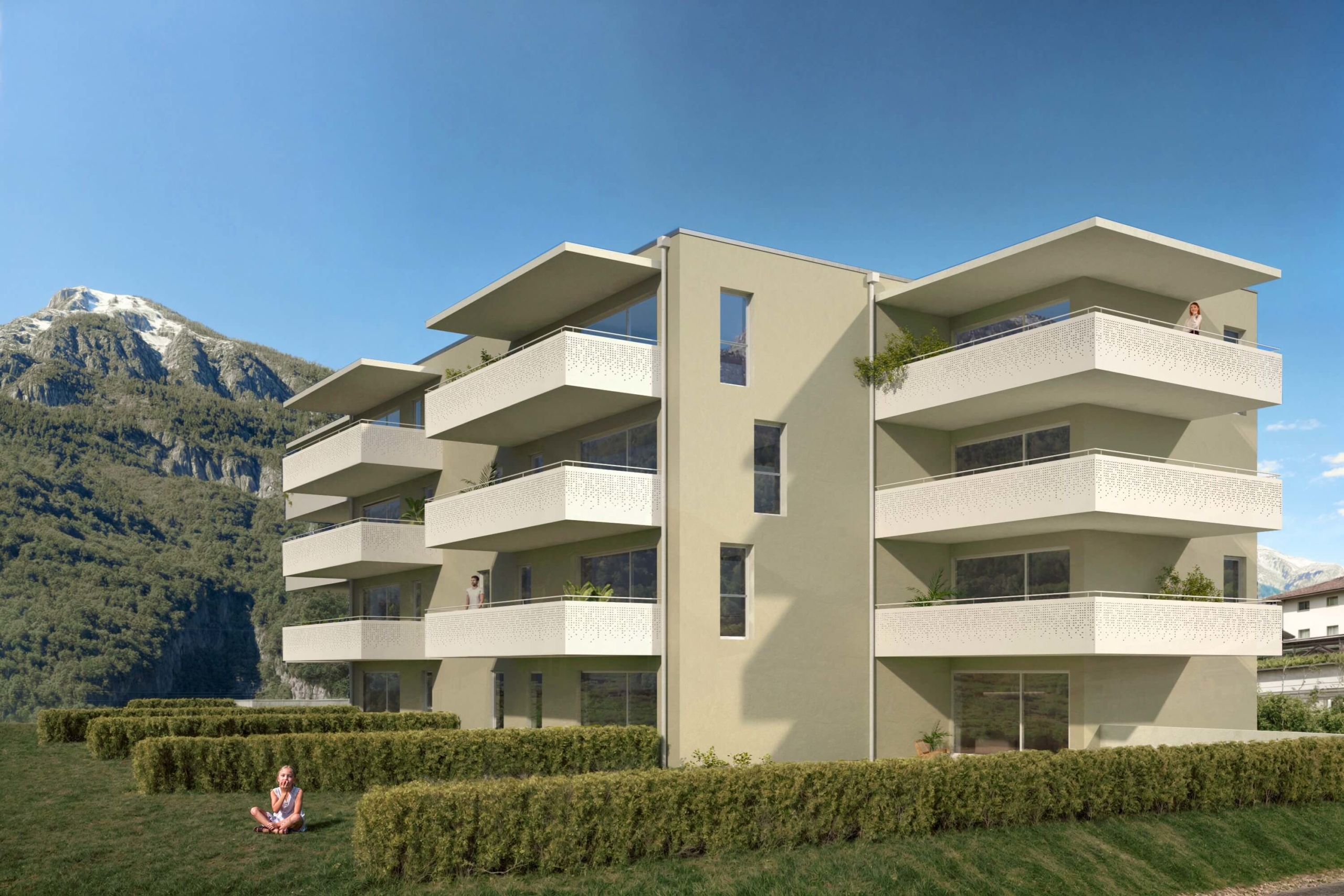 Façade sud-ouest du Clos du Luizet à Saxon, montrant les balcons spacieux et le jardin paysager de la résidence PPE de 16 appartements